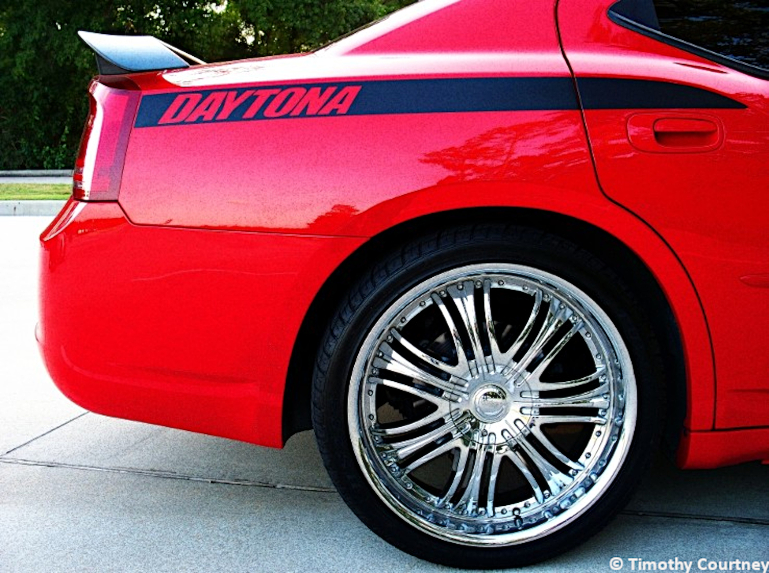 Shiny paint and rims of red car