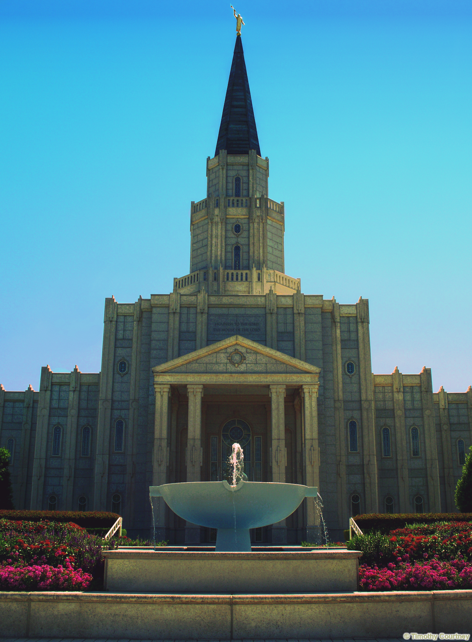 The Houston Texas Temple at Champion Forest Stands in Front of a Large Fountain