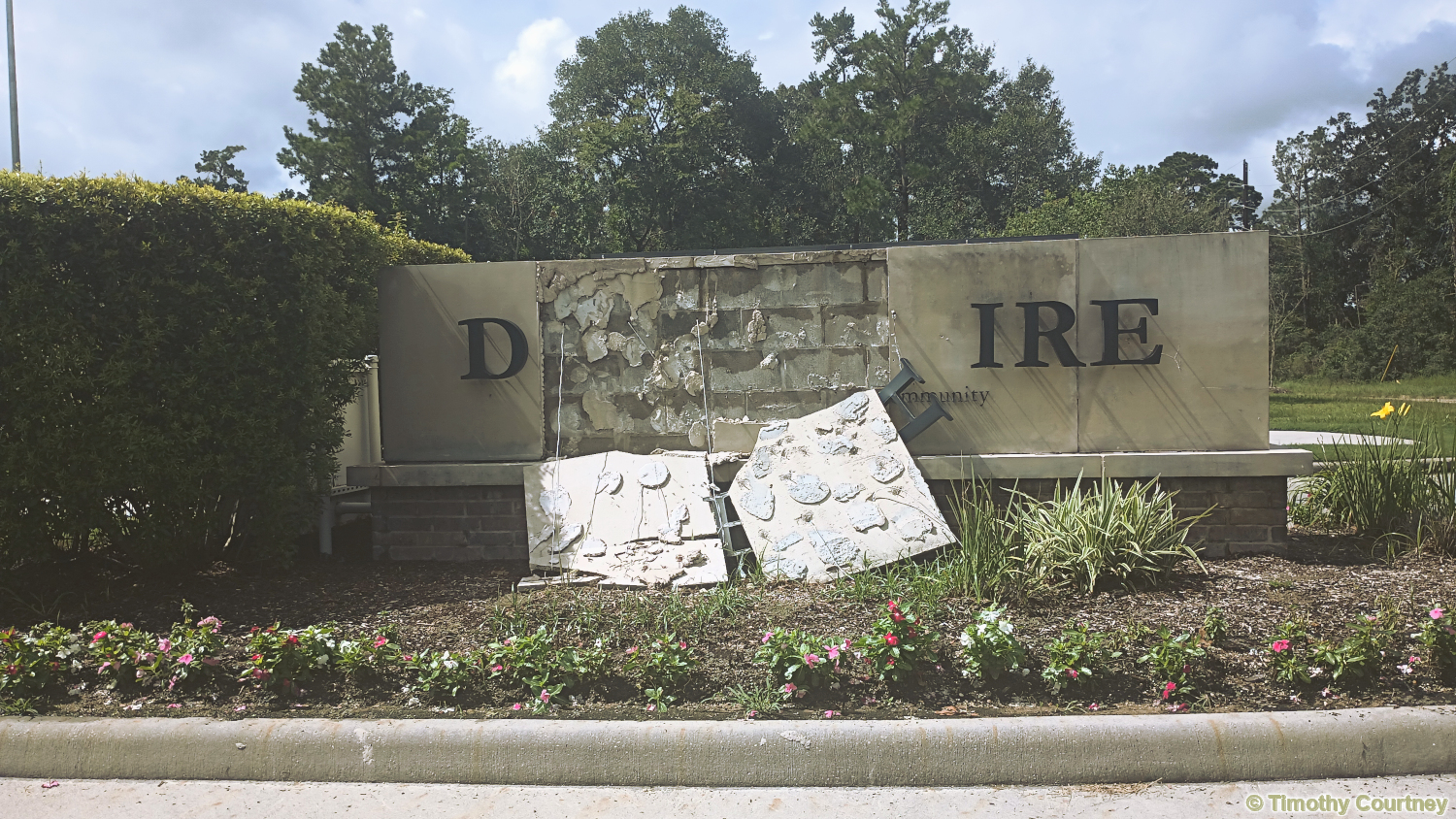 Entrance Sign to a Neighborhood Community Damaged by Hurricane Beryle