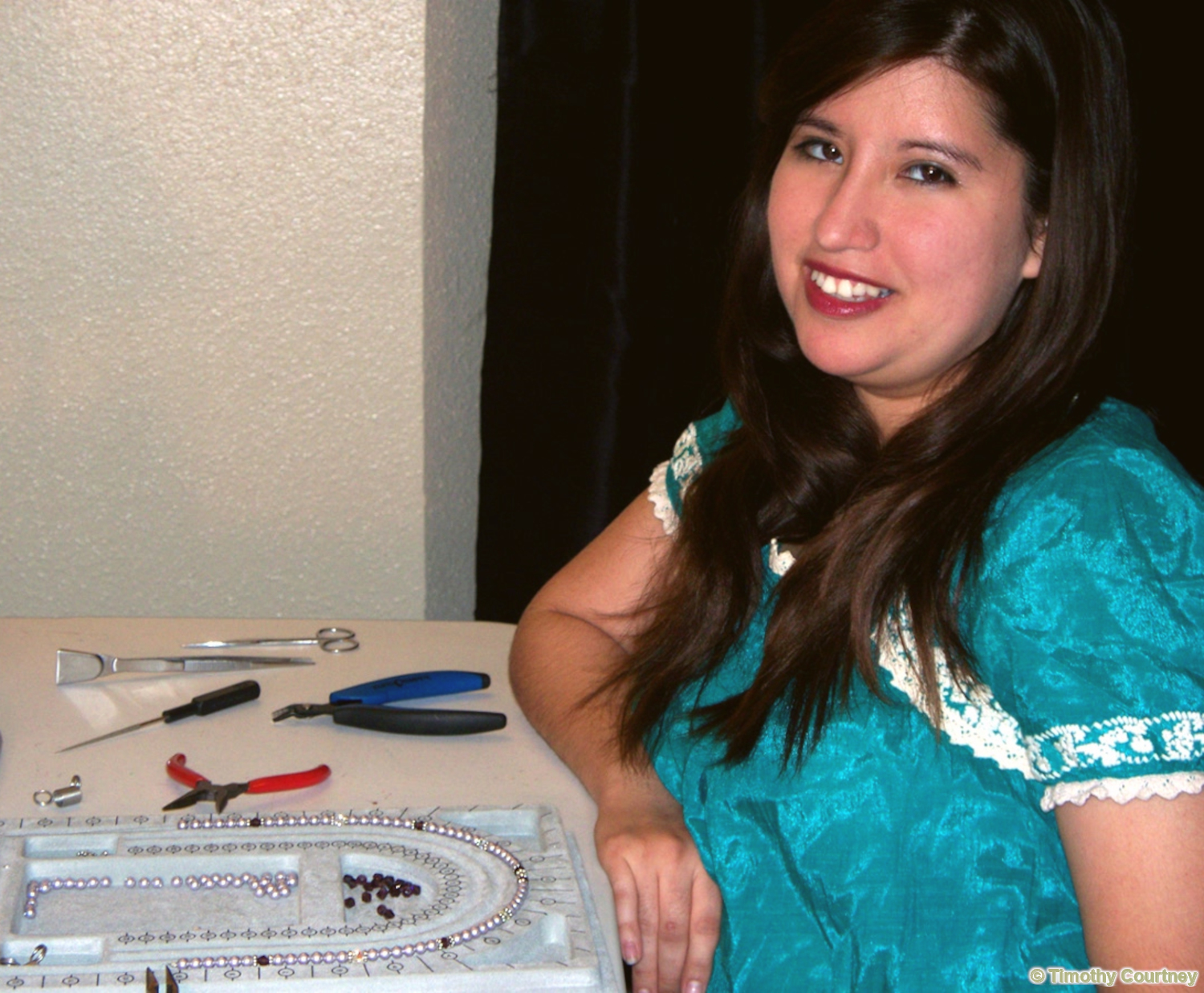 Woman is designing a necklace