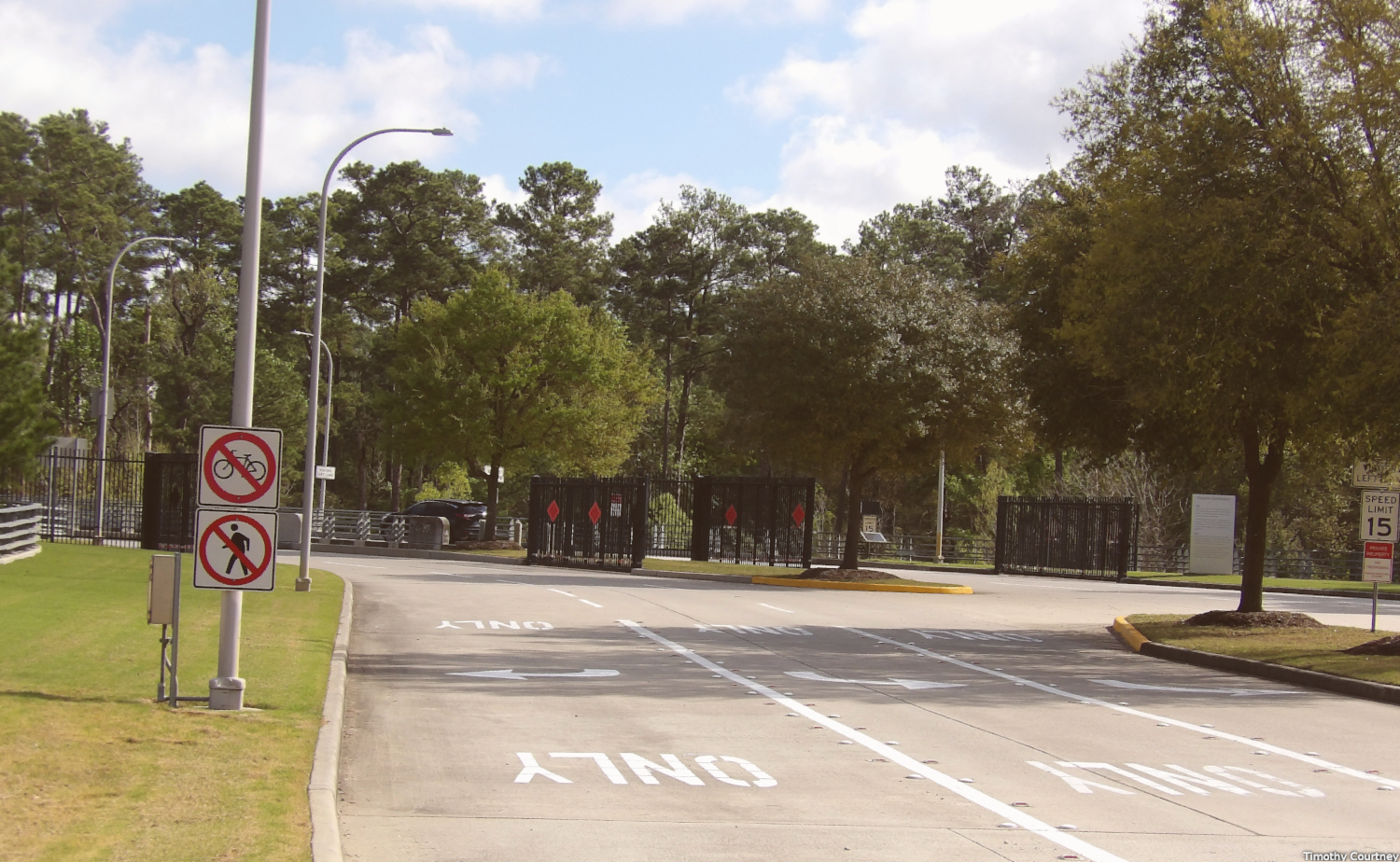 This view of the main entrance to the Exxonmobil campus shows the concrete bridge with steel access gates.